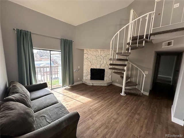 living room with a fireplace and hardwood / wood-style floors