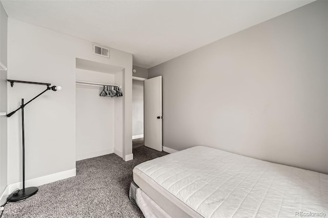 carpeted bedroom featuring a closet