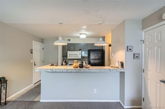 2575 S Syracuse Way Unit B107, Denver, CO 80231 - kitchen with white appliances, a peninsula, light countertops, a textured ceiling, and tile patterned floors