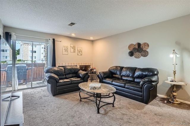 2575 S Syracuse Way Unit B107, Denver, CO 80231 - living area featuring carpet flooring and a textured ceiling
