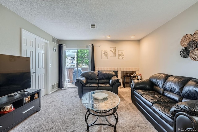 2575 S Syracuse Way Unit B107, Denver, CO 80231 - living room featuring carpet floors and a textured ceiling