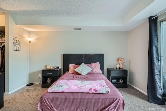 2575 S Syracuse Way Unit B107, Denver, CO 80231 - carpeted bedroom featuring a textured ceiling