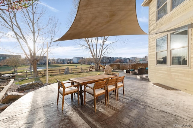 view of patio / terrace with outdoor dining space and fence