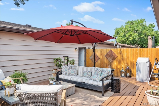 wooden terrace featuring an outdoor hangout area