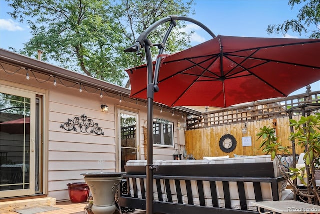 view of patio with a wooden deck and outdoor lounge area