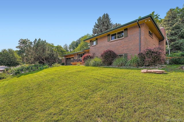 7875 W 21st Ave, Lakewood, CO 80214 - view of green lawn with an attached garage