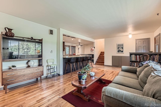 7875 W 21st Ave, Lakewood, CO 80214 - living area featuring stairway and light wood-style floors