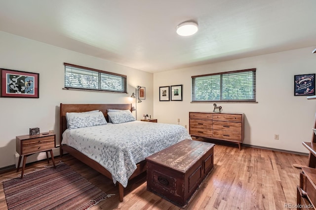 7875 W 21st Ave, Lakewood, CO 80214 - bedroom with light wood finished floors and baseboards