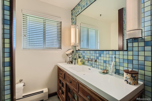 7875 W 21st Ave, Lakewood, CO 80214 - bathroom with a baseboard heating unit, tasteful backsplash, and vanity