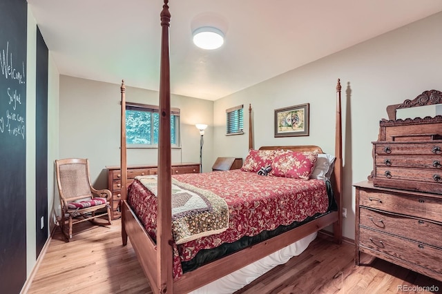7875 W 21st Ave, Lakewood, CO 80214 - bedroom featuring light wood-type flooring and baseboards