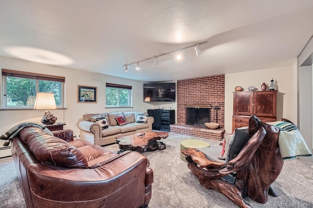 7875 W 21st Ave, Lakewood, CO 80214 - living area featuring carpet floors, a brick fireplace, and track lighting