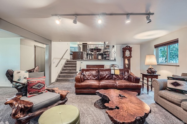 7875 W 21st Ave, Lakewood, CO 80214 - living area featuring track lighting, carpet flooring, stairs, and a baseboard heating unit