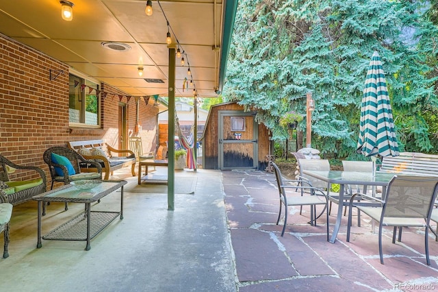 7875 W 21st Ave, Lakewood, CO 80214 - view of patio with a storage shed and outdoor dining space