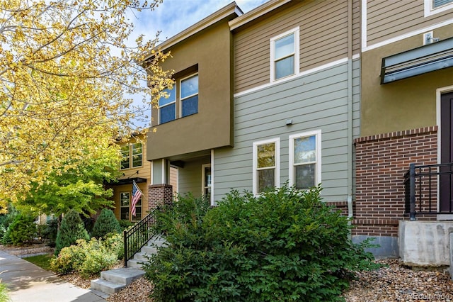 exterior space featuring brick siding