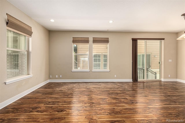 unfurnished room with recessed lighting, baseboards, a healthy amount of sunlight, and wood finished floors