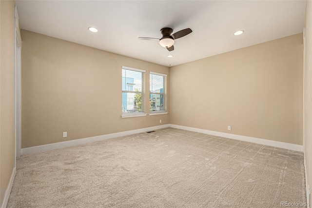 unfurnished room featuring recessed lighting, a ceiling fan, baseboards, and light carpet