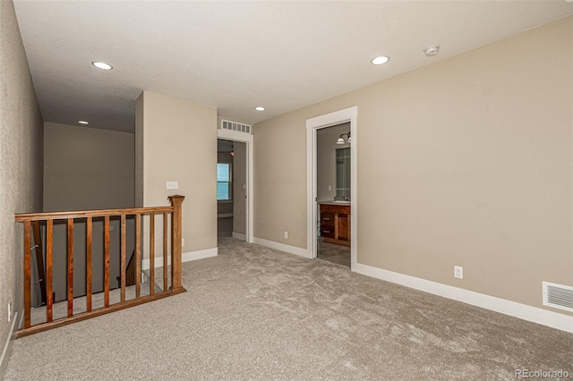 empty room featuring carpet floors