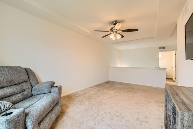 12981 E 108th Way, Commerce City, CO 80022 - sitting room featuring light carpet, a tray ceiling, and ceiling fan