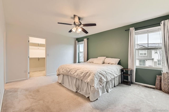 12981 E 108th Way, Commerce City, CO 80022 - bedroom featuring light carpet, multiple windows, a ceiling fan, and a spacious closet