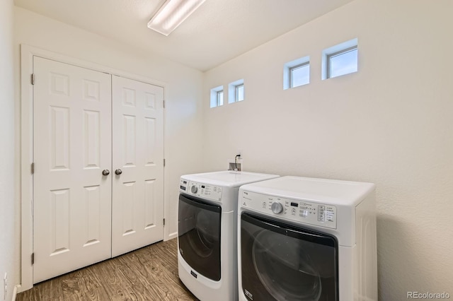 12981 E 108th Way, Commerce City, CO 80022 - laundry room featuring washing machine and clothes dryer and light wood-style flooring