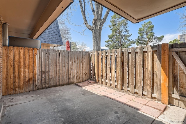 view of patio / terrace featuring fence