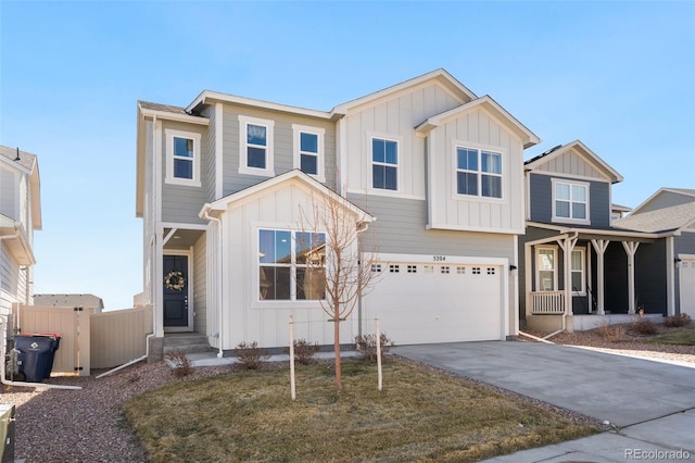 view of front of home with an attached garage, fence, board and batten siding, and concrete driveway