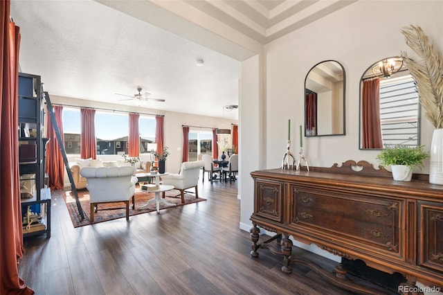 interior space with a ceiling fan and wood finished floors