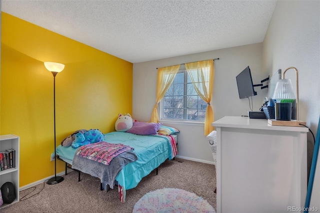 bedroom with a textured ceiling, carpet flooring, and baseboards