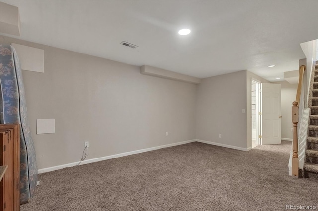 carpeted empty room with recessed lighting, baseboards, visible vents, and stairs