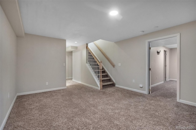 below grade area with recessed lighting, carpet floors, stairs, and baseboards