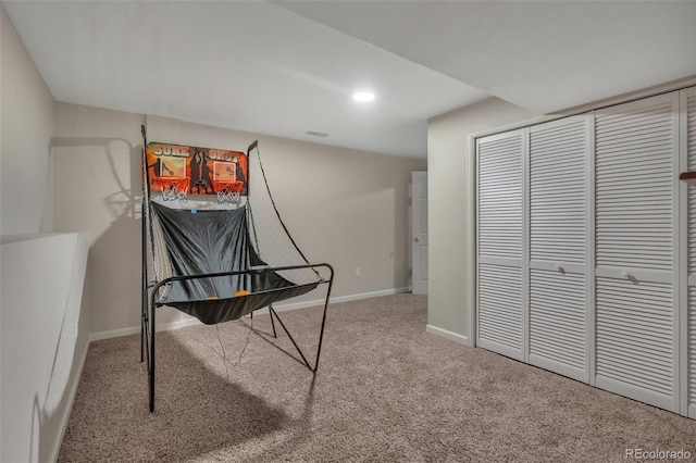 recreation room featuring carpet floors and baseboards