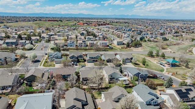 birds eye view of property with a mountain view and a residential view