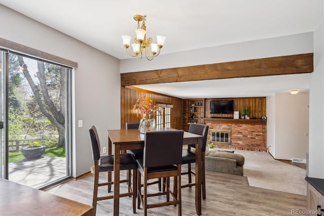 7942 S Vincennes Way, Centennial, CO 80112 - dining space featuring baseboards, an inviting chandelier, and light wood finished floors