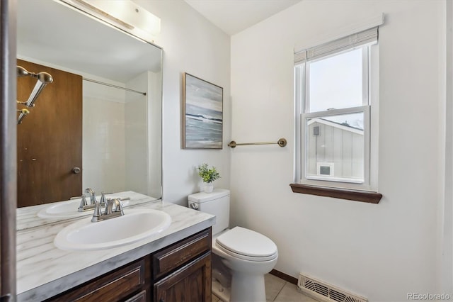 7942 S Vincennes Way, Centennial, CO 80112 - full bathroom featuring walk in shower, tile patterned flooring, vanity, toilet, and visible vents