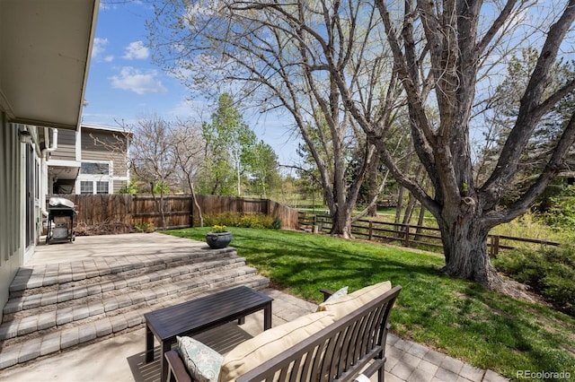 7942 S Vincennes Way, Centennial, CO 80112 - view of patio featuring a fenced backyard and grilling area