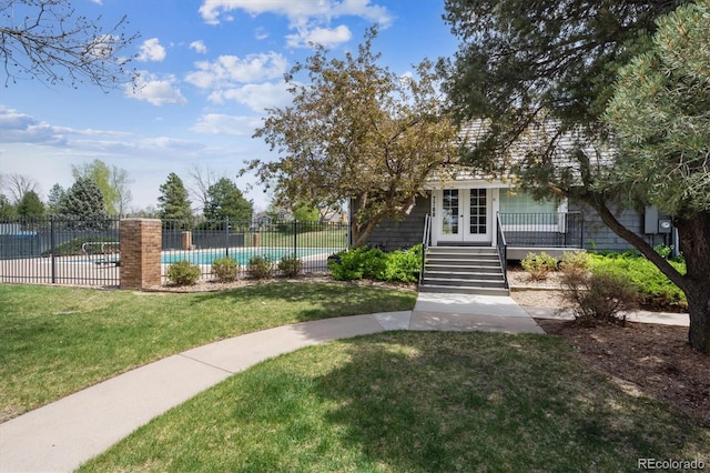 7942 S Vincennes Way, Centennial, CO 80112 - view of front of property featuring stairs, fence, french doors, and a front yard