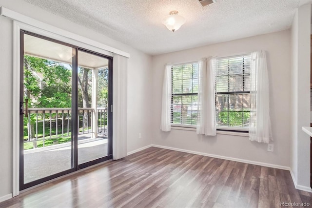 10950 W Florida Ave Unit 314, Lakewood, CO 80232 - unfurnished room featuring wood finished floors and a textured ceiling