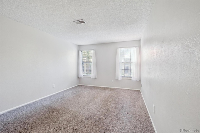 10950 W Florida Ave Unit 314, Lakewood, CO 80232 - carpeted spare room featuring baseboards and a textured ceiling