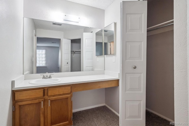 10950 W Florida Ave Unit 314, Lakewood, CO 80232 - bathroom with vanity and a textured ceiling