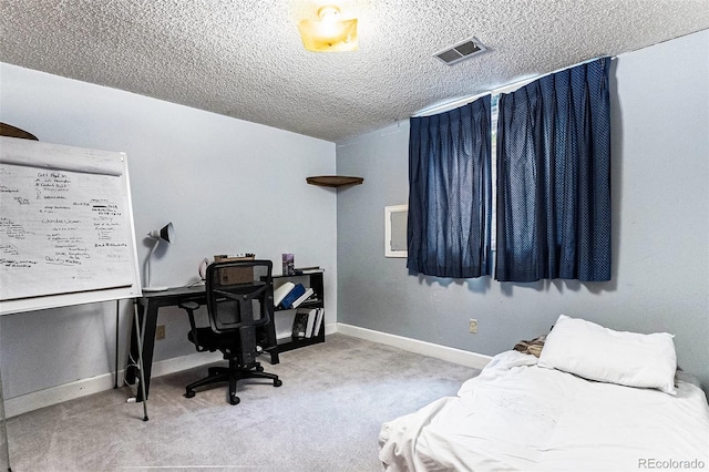 carpeted bedroom with a textured ceiling, visible vents, and baseboards