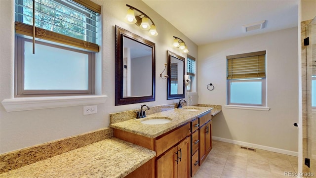 bathroom featuring tile patterned flooring and vanity