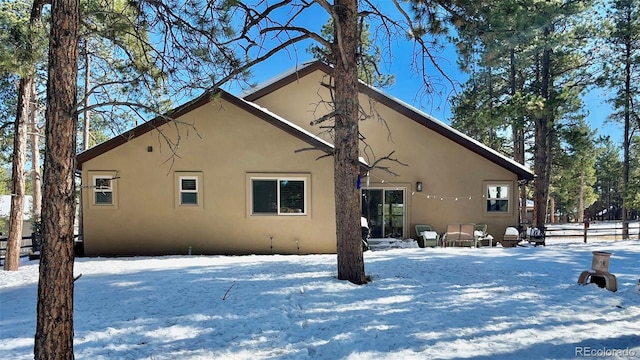 view of snow covered house