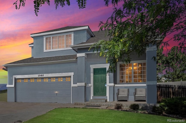 view of front of property with a garage