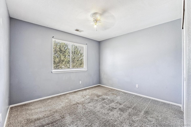 empty room featuring carpet and ceiling fan