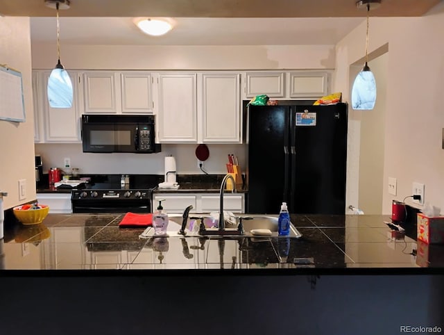 kitchen with white cabinetry, kitchen peninsula, hanging light fixtures, and black appliances