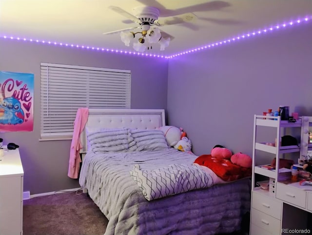 bedroom featuring ceiling fan and dark colored carpet