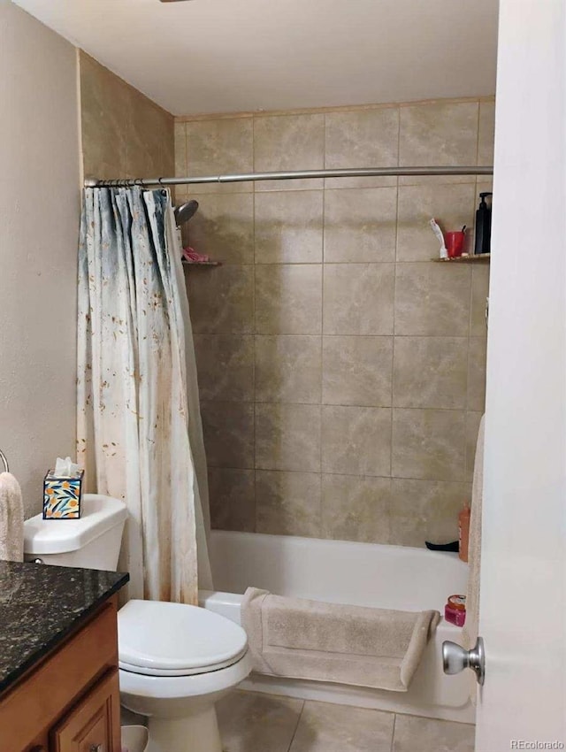 full bathroom featuring shower / tub combo, vanity, toilet, and tile patterned flooring