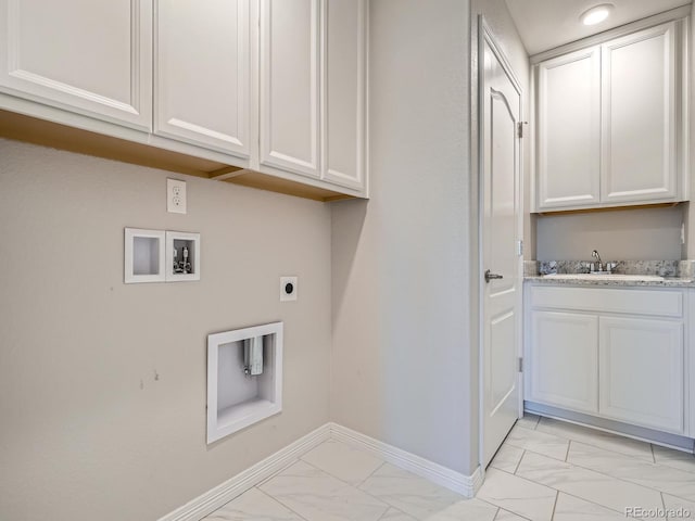 washroom with hookup for a washing machine, a sink, baseboards, marble finish floor, and electric dryer hookup