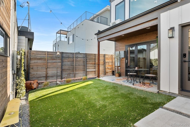 view of yard with a patio area and a fenced backyard