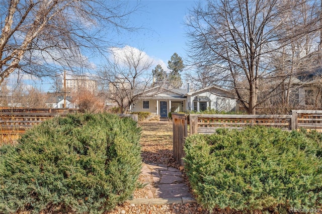 view of front of home featuring fence